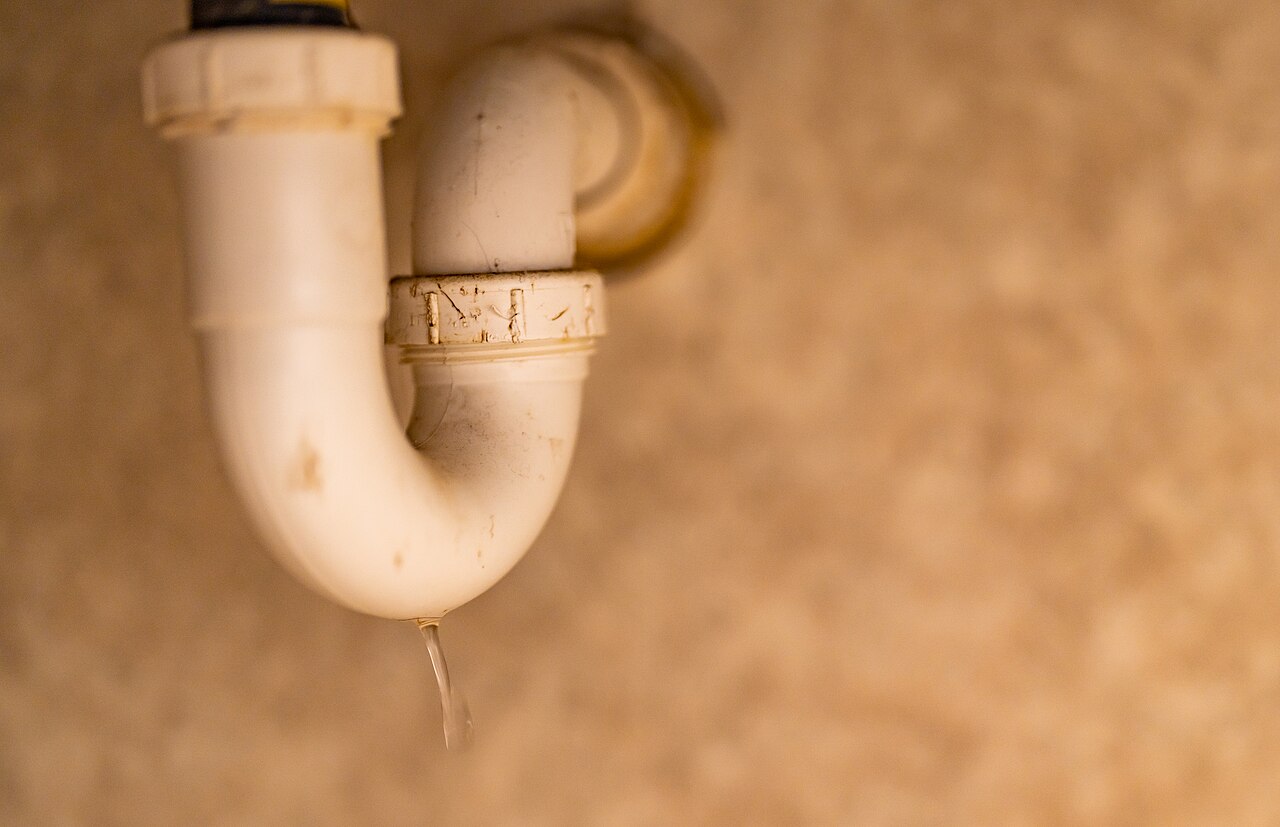 White PVC pipework under a sink