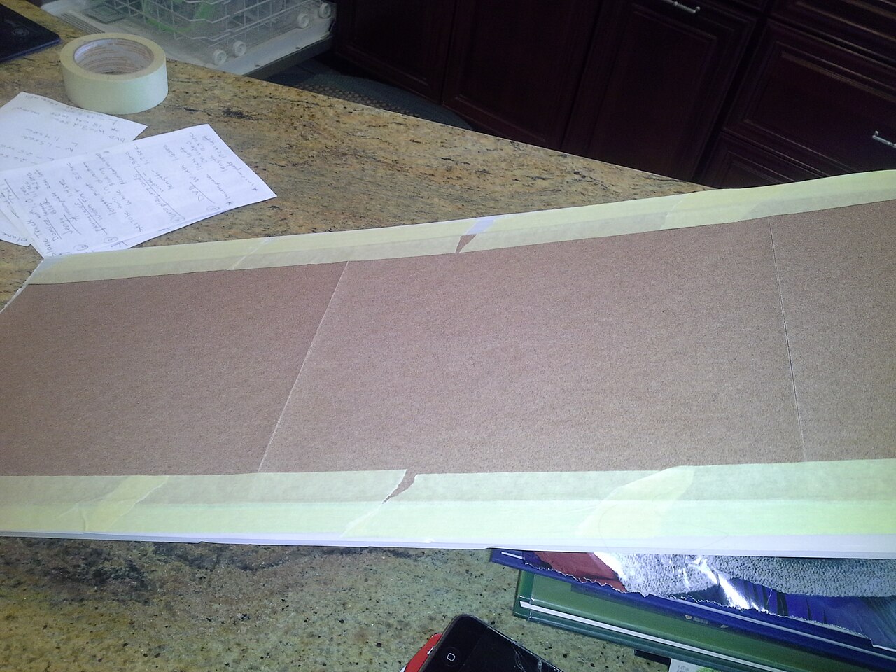 A close-up view of 100 grit sandpaper