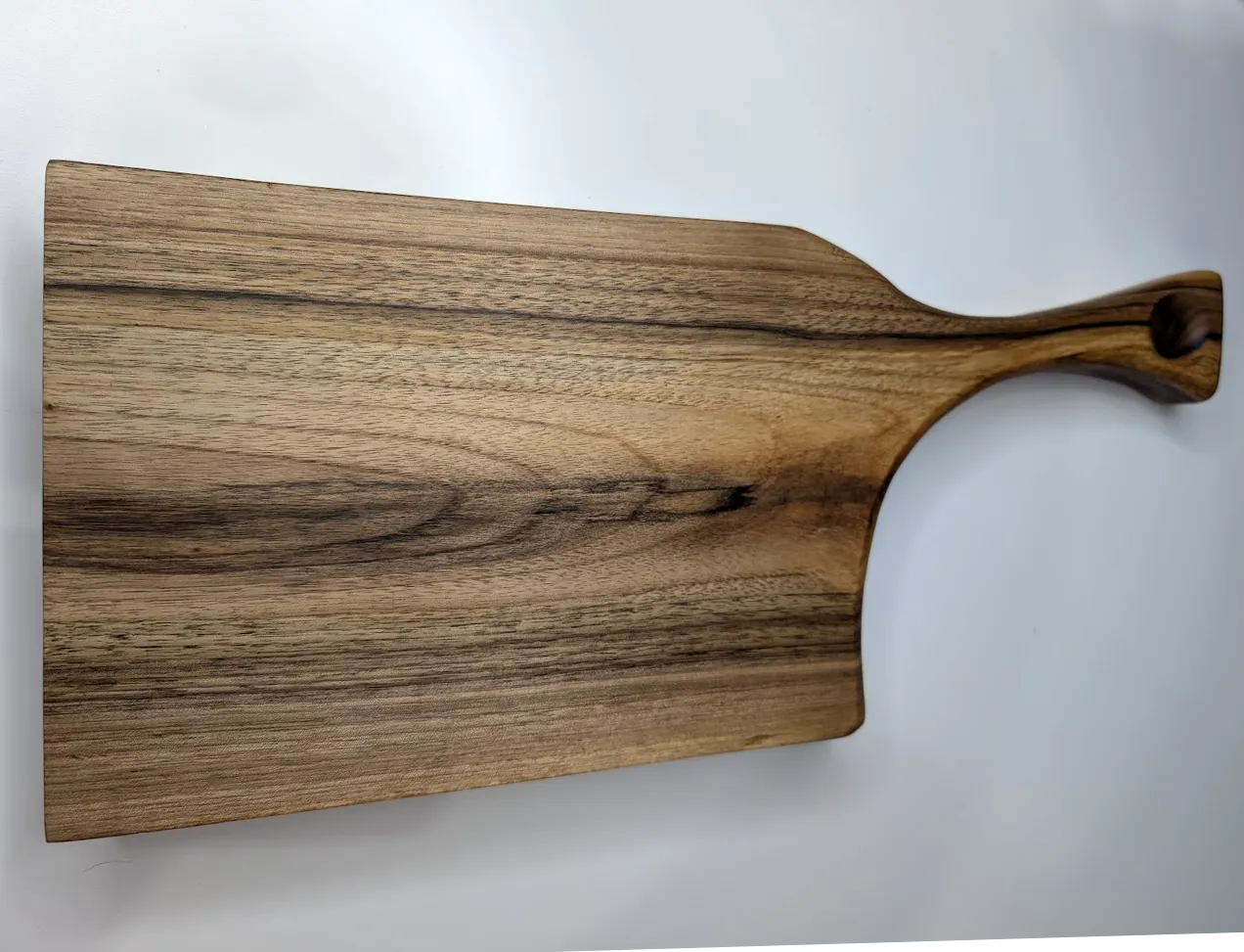 A close-up view walnut rain in a cutting board